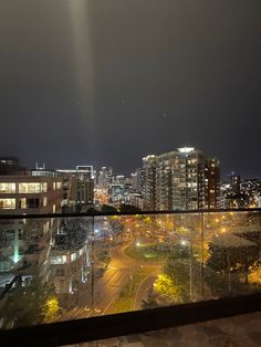 the city is lit up at night and it looks like there are lights on the buildings