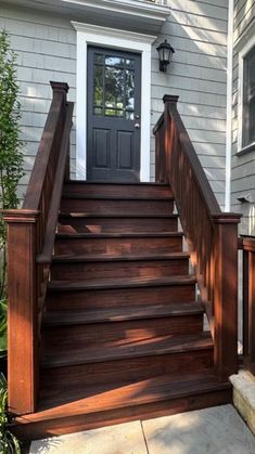 wooden steps leading up to a front door