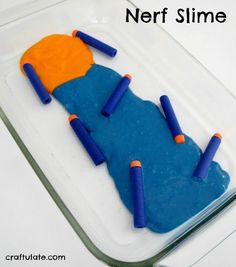 a cake made to look like a child's bed with blue and orange crayons