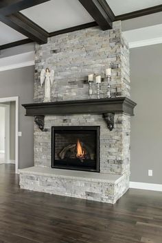 a fireplace with some candles on top of it