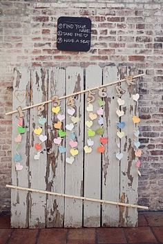 a wooden fence with hearts on it