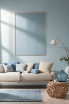 a living room with blue walls and white furniture