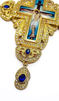 Pectoral Cross Blue Crystals Pendant Gold-plated 18k Pectoral Cross with crystallized glass elements, With a Beautiful illustration of Jesus Christ. Beautiful handcrafted Cross on Iron base, plated in gold and silver to ensure durability and prevent corrosion tarnish. Clergy Cross pendant length (H X W): 16 cm x 8 cm / 6.3" x 3.1" , Chain Length: 60 cm / 23". Packed in a beautiful gift box with velvet base to provide extra protection. Christian priest bishop Cross can be hanged at home or used a Pectoral Cross, Special Necklace, Crystal Necklace Pendant, Beautiful Gift Boxes, Blue Crystals, Crystal Pendant, Gold Plating, Cross Pendant, Crystal Rhinestone