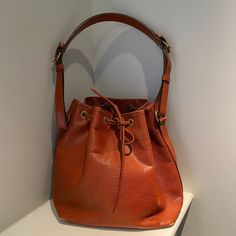 Gorgeous Vintage Louis Vuitton Bucket Bag In Burnt Orange Color. Good Condition- Some Fading To Leather On Corners And A Pen Mark On Front. Hence The Reduced Price. Louis Vuitton Orange, Louis Vuitton Bucket Bag, Louis Vuitton Pallas, Fendi Vintage, Monogram Neverfull, Louis Vuitton Limited Edition, Louis Vuitton Vintage, Louis Vuitton Neverfull Mm, Burnt Orange Color