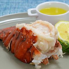 lobster with lemon and dill garnish on a plate