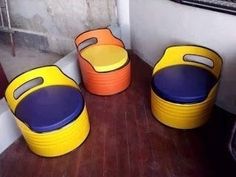 three plastic buckets sitting on top of a wooden floor next to eachother