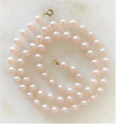 "Natural Faux Pearl Necklace with Gold Tone Spring Ring Clasp Pearls Measure 8mm in Diameter ( 1/4\" in Diameter ) Mot Pearls are Natural Pearl Color 16\" 7.00 18\" 8.50 24\" 9.50 29\" 10.50 36\" 10.50 Endless ( without clasp ) 46\" 11.00 Endless ( without clasp ) COMPLIMENTARY DOMESTIC SHIPPING" Classic Round Hypoallergenic Necklace, Hypoallergenic Pink Jewelry For Formal Occasions, Feminine Single Strand Round Beads Jewelry, Feminine Single Strand Jewelry With Round Beads, Formal Hypoallergenic Jewelry With Round Beads, Hypoallergenic Formal Jewelry With Round Beads, Hypoallergenic Round Bead Jewelry For Formal Occasions, Adjustable Feminine Jewelry With Round Beads, Classic Jewelry With Lobster Clasp And Round Beads