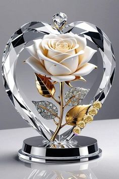 a crystal heart with a white rose in it