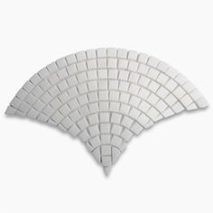 three pieces of white marble tile arranged in the shape of an inverted triangle on a white background