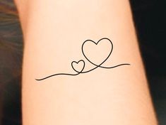 a couple of hearts on the arm with one line drawn to it's side