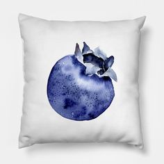 a watercolor painting of a blue pomegranate on a white pillow