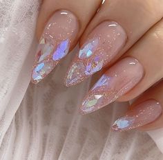 - 100% Handmade polar light crystal nail - Quantity: 10pc acrylic press on in the box - Irregular shaped of crystal charms  - 10 shapes to choose: Short almond, Long almond, Short oval, Long oval, Short coffin, Long coffin, Short stiletto, Long stiletto, Short square, long square * In the photos we used short almond - A free nail glue is offered per each client - Size: XS, S, M, L  Please read our inner arch measurement chart carefully  - Handling time 3-5 days since they are all handmade :)  * How to order * 1. Choose nail shape 2. Choose size How to use: 1. File the sides of the press-on nail to fit your nail beds 2. Apply one nail at a time, cover your whole nail with glue, then align the press-on with your nail bed and press down firmly for 20 seconds. Use UV/ LED lamp  3. Enjoy your n Rave Nails, Nails Extension, Almond Press On Nails, Aurora Nails, Long Stiletto, Glittery Nails, Nail Jewels, Short Almond, Light Crystal