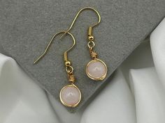 Save when you shop through my website, I'd appreciate it 💚- https://shorturl.at/dGU49 *PLEASE NOTE:  The picture displayed is for reference. Please be advised your chosen crystals will vary slightly. However, they will be equally as beautiful & powerful* 💓 Lovingly Handmade tarnish resistant Rose Quartz drop earrings 💓 8mm crystal spheres! 🤍Rose Quartz Crystal healing benefits ✨ The crystal of eternal love, and supports unconditional love ✨connects & opens the heart chakra, the centre of lov Minimalist Wire Wrapped Crystal Earrings As Gift, Rose Quartz Healing, Rose Quartz Necklace, Handmade Jewelry Gift, Rose Quartz Crystal, Quartz Rose, Drop Earring, Heart Chakra, Healing Crystal