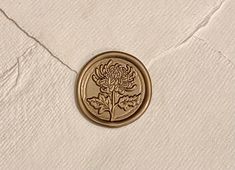 a wax stamp with a flower on it