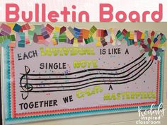 bulletin board with music notes and colorful paper streamers on the bottom, along with words that spell out each song