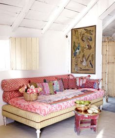 a living room filled with lots of colorful furniture