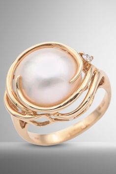 Indulge in timeless elegance with this Vintage 14K Yellow Gold Cocktail Ring. Adorned with a captivating Mabe Pearl and glistening Diamonds, it's a statement of sophistication. Size 6. #VintageFashion #GoldJewelry #PearlAndDiamonds Luxury Vintage Pearl Ring For Formal Occasions, Luxury Gold Pearl Ring For Engagement, Luxury Gold Pearl Ring For Formal Occasions, Modern Luxury Pearl Ring For Formal Occasions, Luxury Vintage Gold Pearl Ring, Luxury Gold Pearl Ring For Wedding, Luxury Formal Pearl Ring, Classic Gold Pearl Ring At Luxury Price, Luxury Vintage Pearl Ring For Formal Events