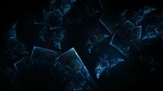 an abstract image of blue and black shapes on a dark background in the middle of the frame