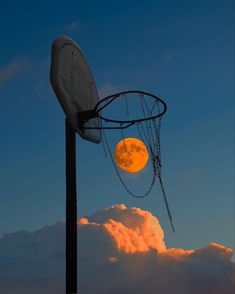 a basketball hoop with the moon in the background