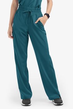 These scrub pants feature a modern fit and high waist with fashionable wide waistband with self drawcord for comfort and fit. For storage there are 5 pockets; 2 front angled pockets with shiny nickel rivet detail, 2 cargo pockets with smooth face ziper closure and 1 concealed power-mesh phone card pocket inside wearers right front pocket. Also has flattering side panels. Easy Stretch scrub collection is designed for a modern look and easy fit for very long shifts and made with performance 4-way Greys Anatomy Men, Scrub Collection, Yoga Scrub Pants, Soft Scrub, Leg Scrub, Uniform Advantage, High Waisted Wide Leg Pants, Mens Scrubs, Scrub Jackets