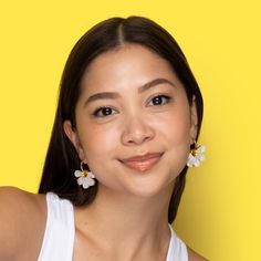 These sweet Daisy charms are so versatile and brighten up any outfit. We love pairing them with a sundress or lace or ruffled details, but they work just as well as a bright burst of white against a dark outfit!  The drops hang from 18mm gold-filled hoops and are removable so you can wear the hoops on their own—two earrings in one, perfect for travel! Wipe clean with a damp cloth. Do not submerge in water. Keep away from extreme heat. Spring Everyday Earrings, Everyday Spring Earrings, White Hypoallergenic Flower Earrings, White Feminine Everyday Earrings, Feminine White Everyday Earrings, Spring Flower Earrings For Everyday Wear, Everyday White Flower Jewelry, White Earrings For Everyday Spring Wear, Feminine White Hypoallergenic Earrings