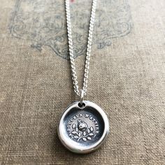 "This sterling silver wax seal pendant features a butterfly resting upon a rose surrounded by the romantic French phrase \"La Douceur M'Attire\" which translates to \"Sweetness Attracts Me\". Love is a delicate dance of the sweetness of two people. Everything in nature lives in an ever-moving connectedness. A plant cannot flourish without water. A butterfly cannot flutter without the sweet nectar of a flower. Humans need to feel this connection to survive. This necklace is a promise of your love Silver Birth Flower Necklace For Anniversary, Silver Birth Flower Necklace For Anniversary Gift, Romantic French Phrases, Flower Necklace Silver, Wax Seal Pendant, Silver Butterfly Necklace, Silver Flower Necklace, Romantic Jewelry, Romantic Jewellery