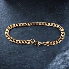 18k gold plated stainless steel curb chain bracelet High Quality 18k Gold plated & water proof ◇ Lengths (inches): 6" (XS)7" (S)8" (M)9" (L)◇Choose between 3mm or 5mm widthSimple staple piece of jewelry perfect for everyday wear !◇ Jewelry comes in a custom Machi Jewelry pouch🎁 gift boxes/wrapping costs an extra £3 which can be added at checkout. Tarnish Resistant Stainless Steel Chain Link Bracelets, Stainless Steel Tarnish Resistant Chain Link Bracelets, Gold Metal Curb Chain Bracelet For Gift, Gold Curb Chain Bracelet Gift, Gold Curb Chain Bracelet As Gift, Cuban Link Stainless Steel Bracelet With Adjustable Chain, Gold Curb Chain Metal Bracelet, Stainless Steel Cuban Link Bracelet With Adjustable Chain, Gold Metal Curb Chain Bracelet