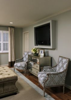 the bedroom is decorated in gray and white