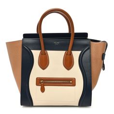 This is an authentic CELINE Elephant Calfskin Mini Tri-Color Luggage in Brown. This stylish tote is crafted of luxuriously smooth calfskin leather in beige and black with grained calfskin in brown. The bag features light brown rolled leather top handles and a decorative signature Celine scroll trim and expansive sides. The top overextended zipper opens to a spacious leather interior with a zipper and patch pockets. Beige And Black, Feature Light, Leather Interior, Leather Top, Tri Color, Light Brown, Patch Pocket, Calf Skin, Handles