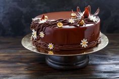 a chocolate cake sitting on top of a wooden table