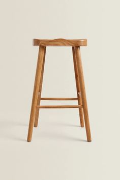 a wooden stool on a white background