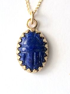 Luxurious lapis lazuli scarab pendant handmade necklace is a great gift for the self, or a loved one. This deep blue semi precious stone was hand cut and is mounted in a solid 14K gold crown bezel. Scarabs are considered to signify new beginnings and good luck. Solid gold lapis pendant is 19mm by 11.5mm. Strung on a vintage 18 inch 14K gold filled chain, included with pendant. We gift box all our jewelry. Need your gift wrapped and a short note? Leave a message to Carol at checkout for this comp Scarab Pendant, Rose Gold Cuff Bracelet, Short Note, Scarab Bracelet, Lapis Pendant, Gold And Silver Rings, Gold Jewelry Necklace, Semi Precious Stone, Gold Crown