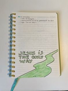 a notebook with the words jesus is the only way written in green ink on it