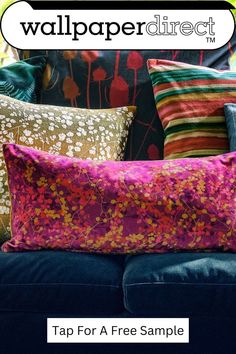 a couch with colorful pillows on it and the words wallpaper direct written in white