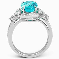 This ring is truly extraordinary, centering around an incredibly bright large 4.04 ctw paraiba tourmaline. This gem is surrounded by 0.31 ctw of round diamonds and .66 ctw of pear shaped diamonds set into nature inspired elements crafted in 18k white gold Item can be viewed in store upon request under no obligation to buy Center gemstone included in the ring Includes ring box Includes jewelry appraisal Ships fully insured to point of delivery All orders placed out of NY state (ordered by an out G Ring, Cheap Diamond Rings, Paraiba Tourmaline, Jewelry Appraisal, Best Engagement Rings, Diamond Necklaces, Tourmaline Jewelry, Buying Diamonds, Jewelry Rings Diamond