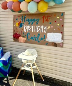 a birthday party with balloons and cake