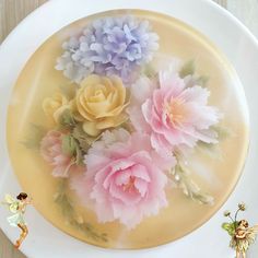 there is a cake decorated with flowers on the plate