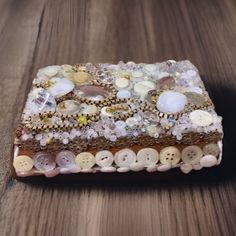 a wooden table topped with lots of buttons