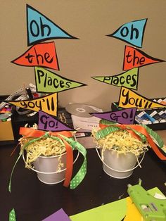 two buckets filled with shredded cheese sitting on top of a table