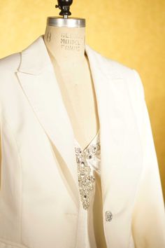 "ABOUT THIS SUIT: Classic cut wool gabardine tuxedo.  With slim peak lapels and  made to fit your body. This tuxedo features flap pockets, a curved front hem, a low neckline, flared cuffs, and a rhinestone studded button. The pants have a wide leg with cuffs, but we can make them in many different cuts to get the look that is best for you. This is just an example of what we can make.  We work with you to design a piece in your style with the details that you like.  The price on this listing incl Women's Tuxedo, Black Tie Event Dresses, Dress For The Wedding, Ladies Suits, Tuxedo Women, Low Neckline, Black Tuxedo, Custom Jacket, Peak Lapel