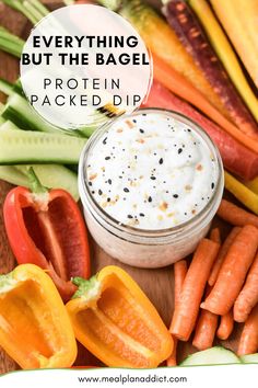 an assortment of veggies and dips with the words everything but the bagel protein packed dip