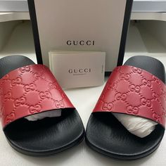 Style 454330 Cwc00 6433 A Gucci Signature Slide Sandal. Made In Heat Debossed Gucci Signature Leather Resulting In A Defined Print With A Firm Texture. Hibiscus Red, Gucci Slides, Shoes Gucci, Swag Shoes, Leather Slides, Pretty Shoes, Gucci Shoes, Slide Sandals, Women's Shoes Sandals