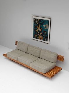 a couch sitting on top of a wooden frame