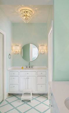 a bathroom with two sinks and a large mirror