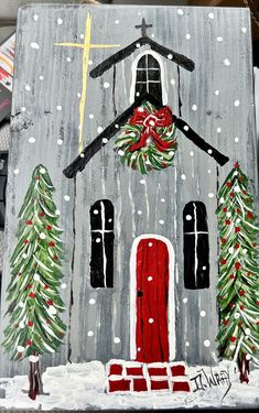 a painting of a church with christmas trees and wreaths on the front, painted in acrylic paint