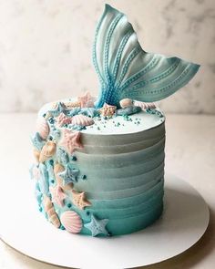 there is a cake decorated with shells and stars