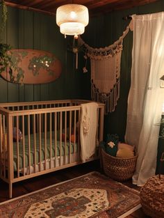 a baby's room with a crib, rugs and lights hanging from the ceiling