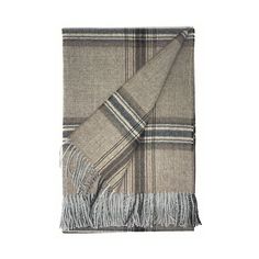 a plaid blanket with fringes on the bottom and one in grey, white and black