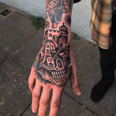 a person with a tattoo on their hand