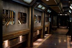 the inside of a train car with windows and lights